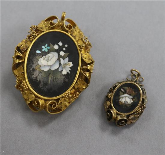 A Victorian yellow metal and pietra dura oval pendant brooch and a pietra dura pendant, largest 47mm,.